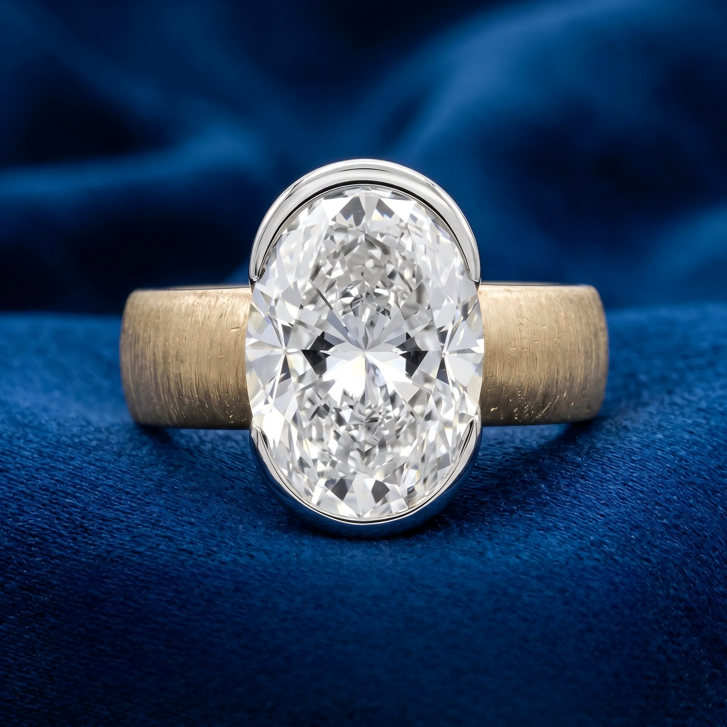 Two-tone gold oval diamond ring