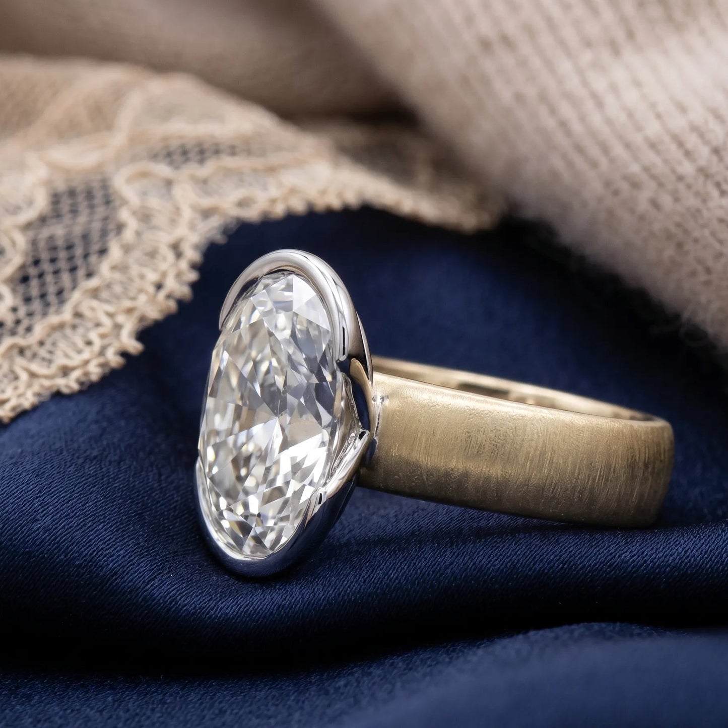 Two-tone gold oval diamond ring